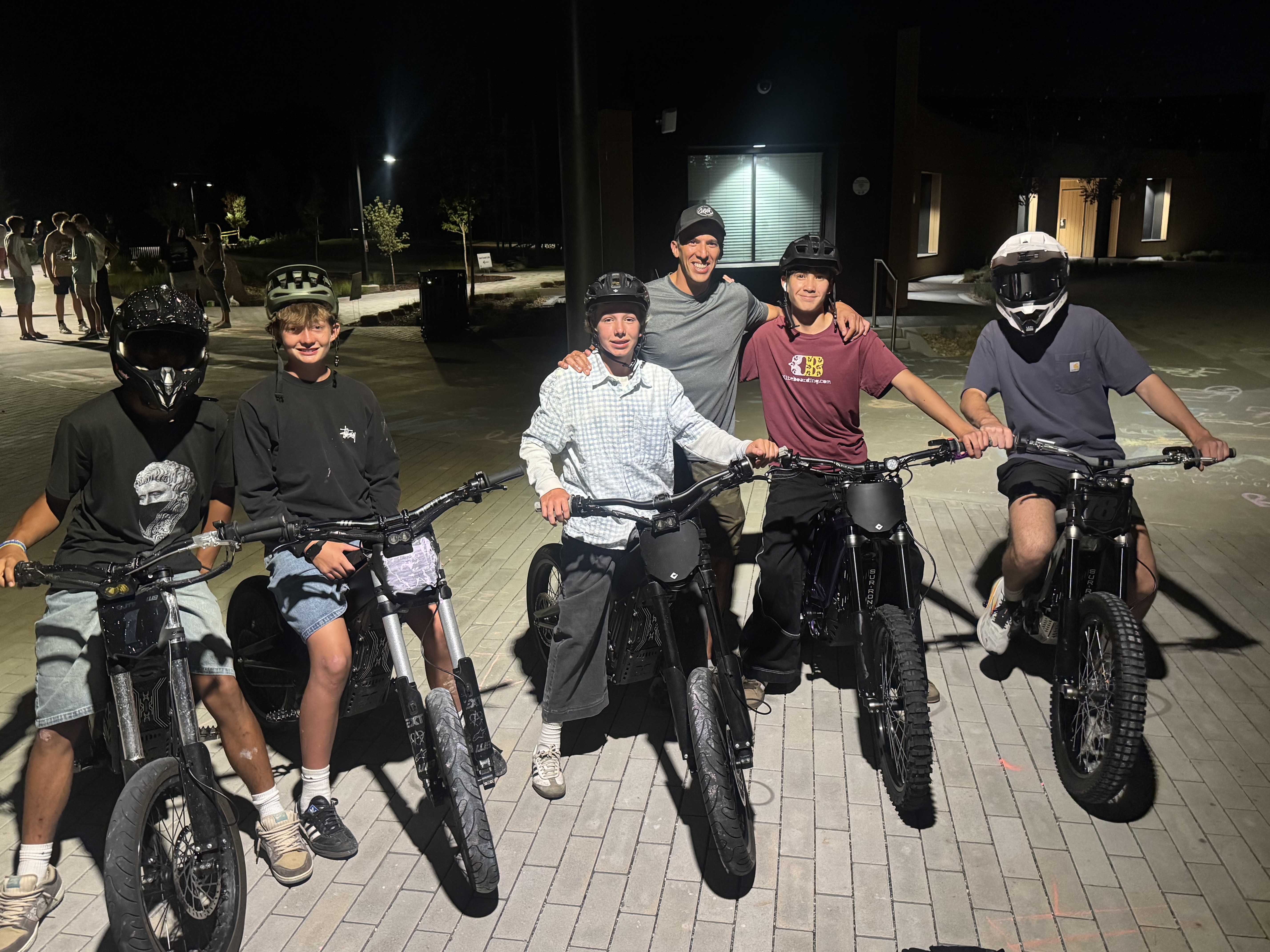 Maximus and friends on dirt bikes at night