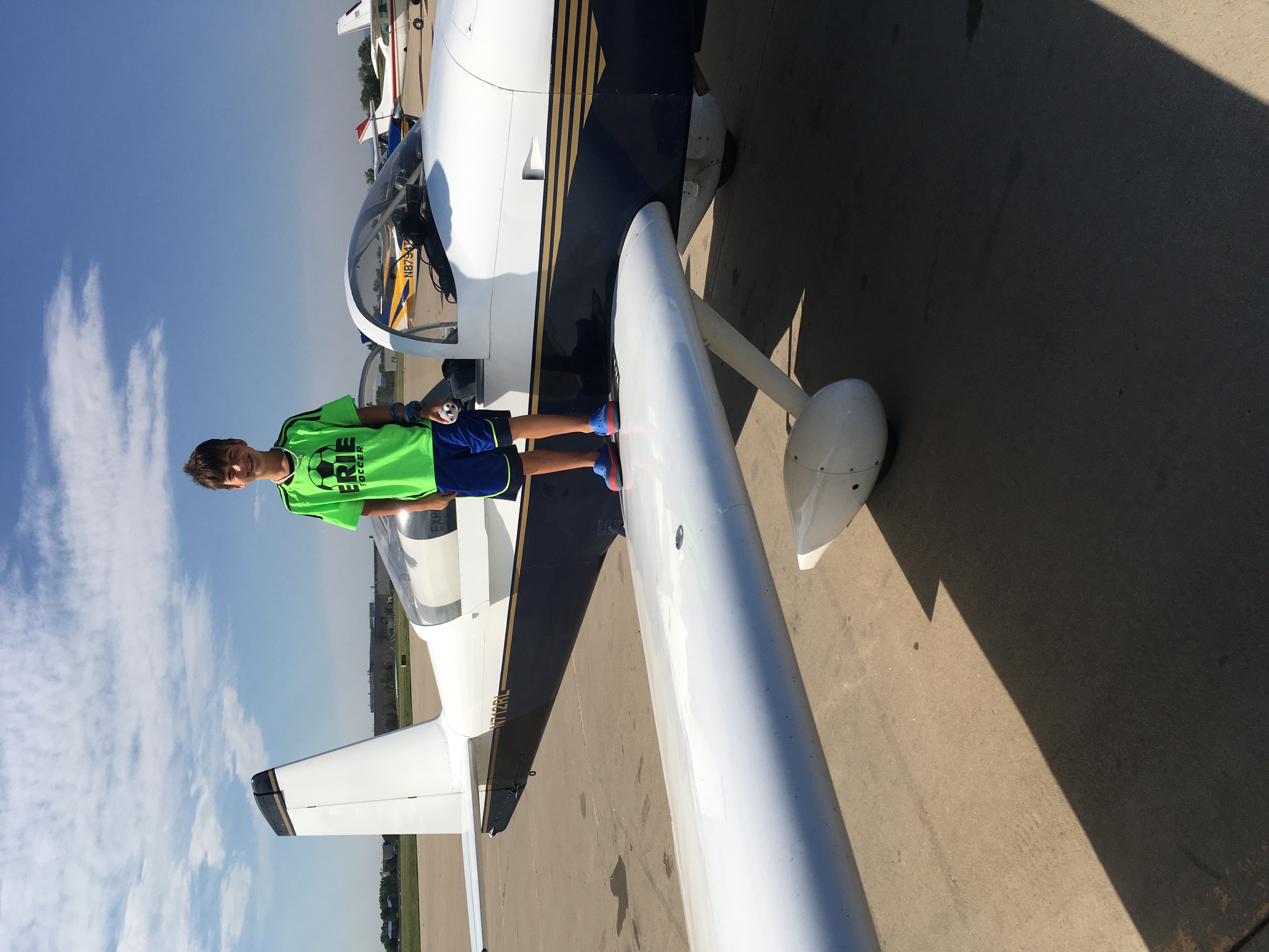 Young Maximus on airplane wing