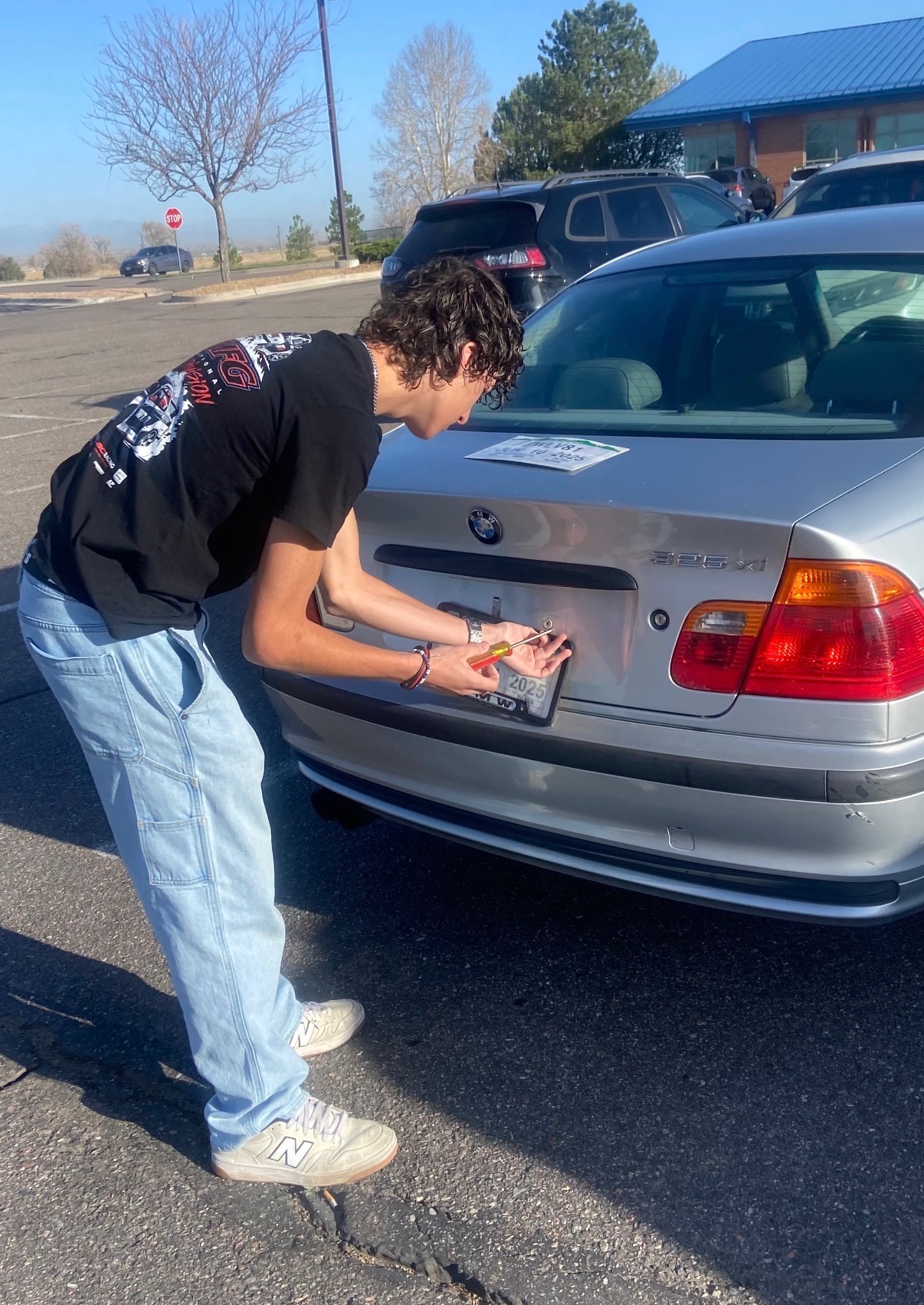 Maximus working on his BMW