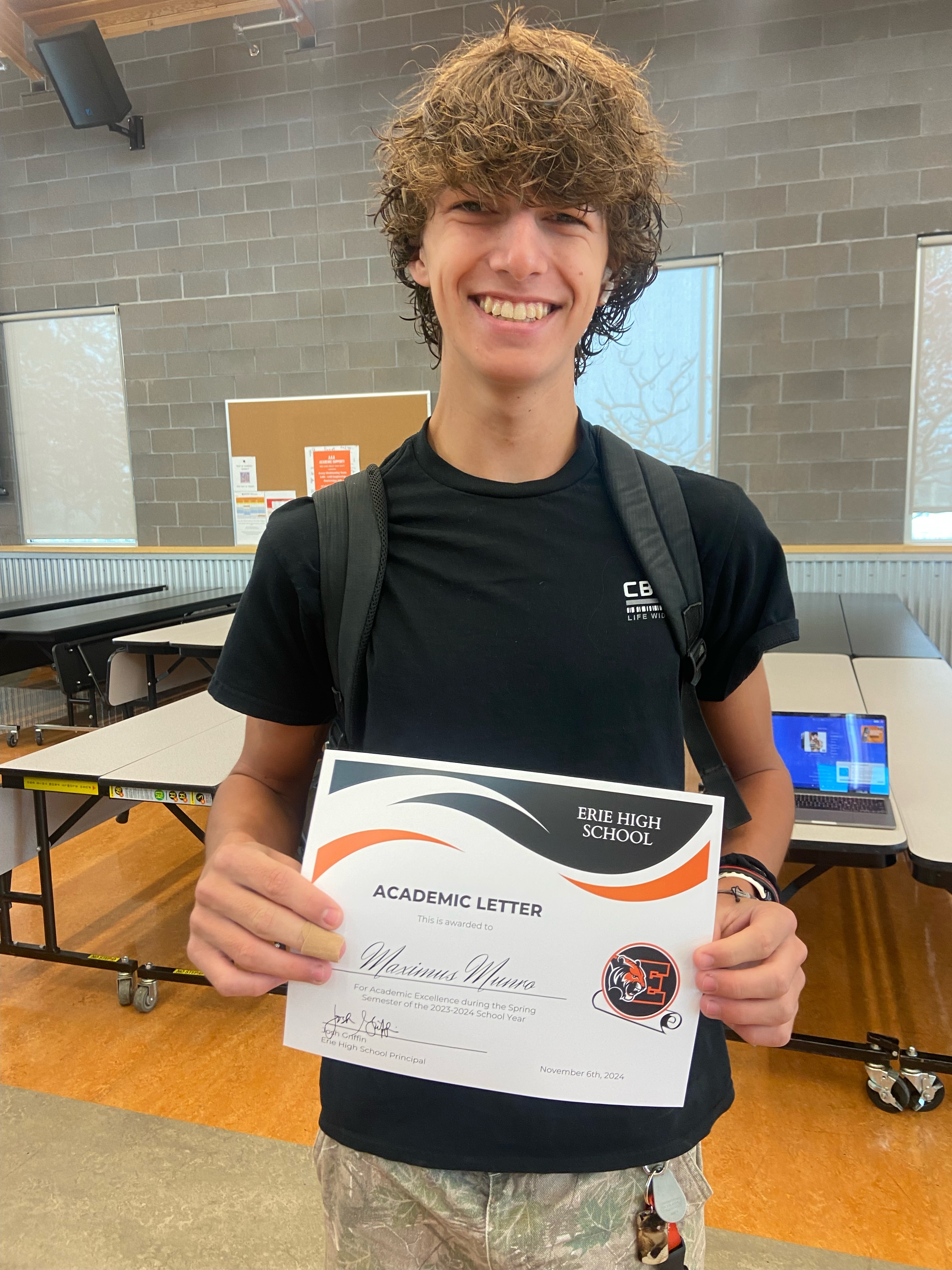 Maximus receiving his academic award